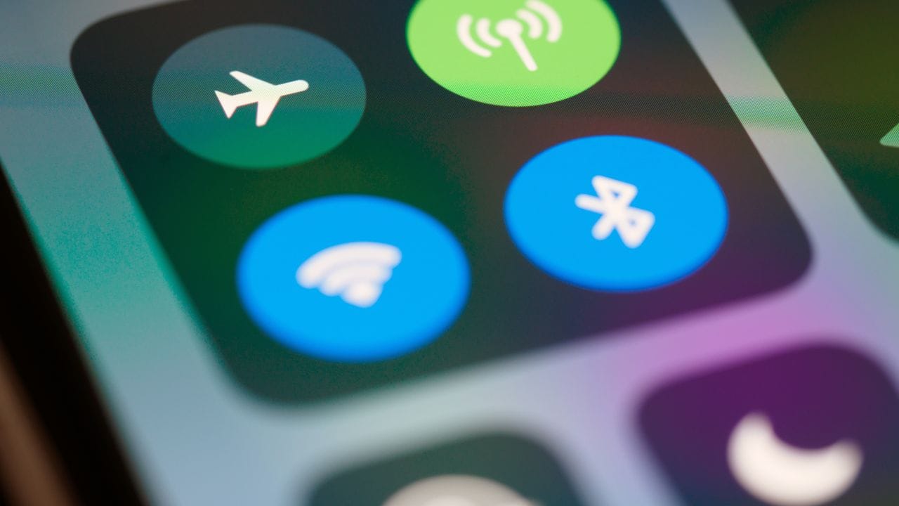 Close-up of a phone's control centre with flight mode and mobile data buttons